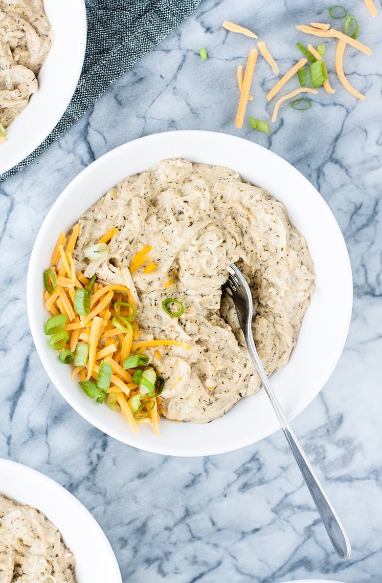 hero shot for Keto Creamy Ranch Chicken Freezer Meal in a bowl garnished with cheddar and green onions