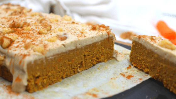 cloe-up shot of carrot cake protein bar atop a marble kitchen counter