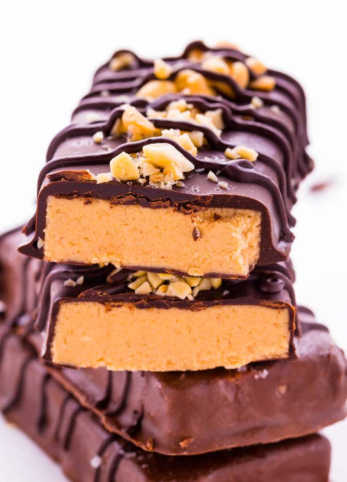 4 no-bake chocolate peanut butter protein bars stacked on top each other
