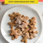 keto gingerbread cookies on a white porcelain plate atop a marble kitchen counter