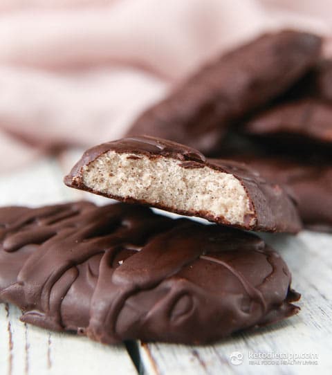 1 half bitten maple pecan protein bars on top of one other