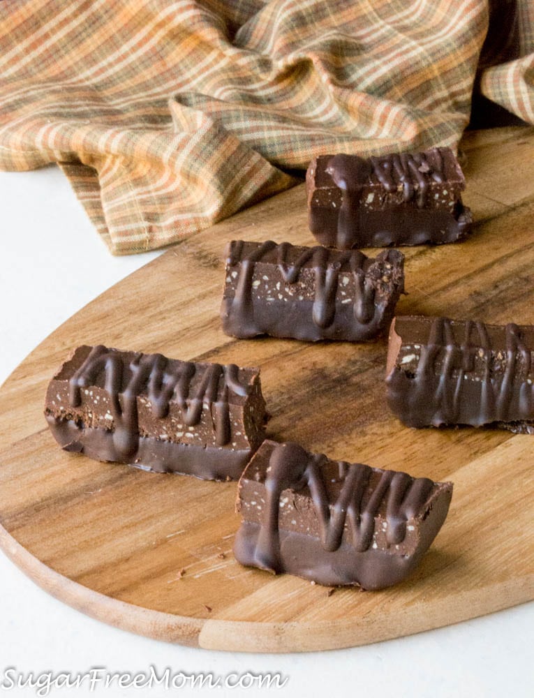 5 low carb chocolate fudge protein bars on a wooden tray