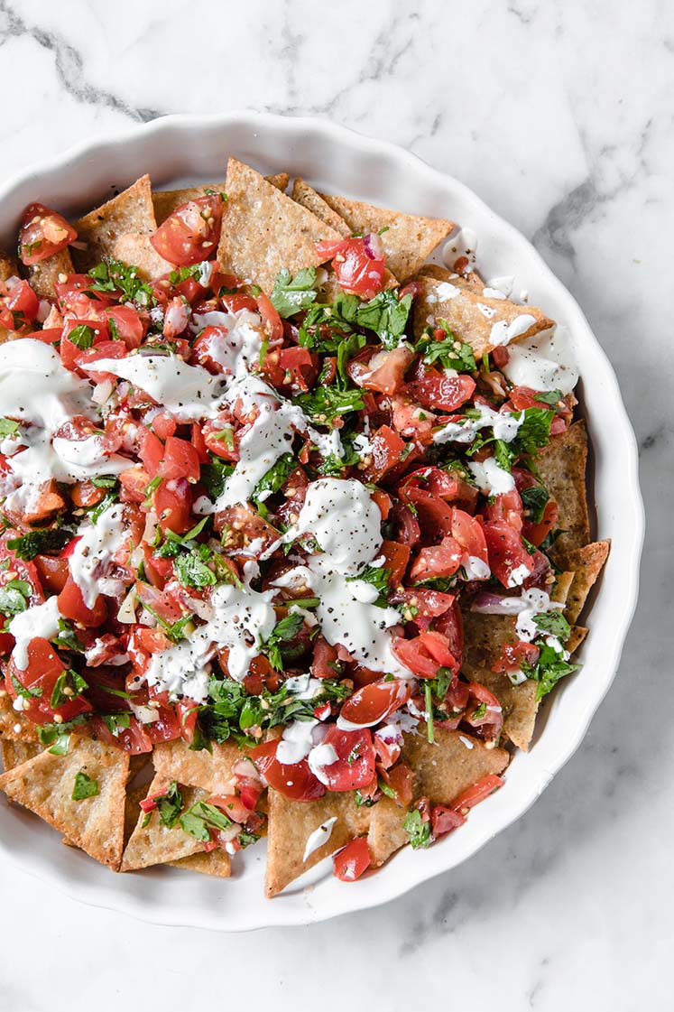 overhead close-up shot of nut free keto nachos topped with keto salsa