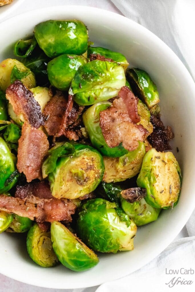 stir-fried brussel sprouts with a bacon in a bowl