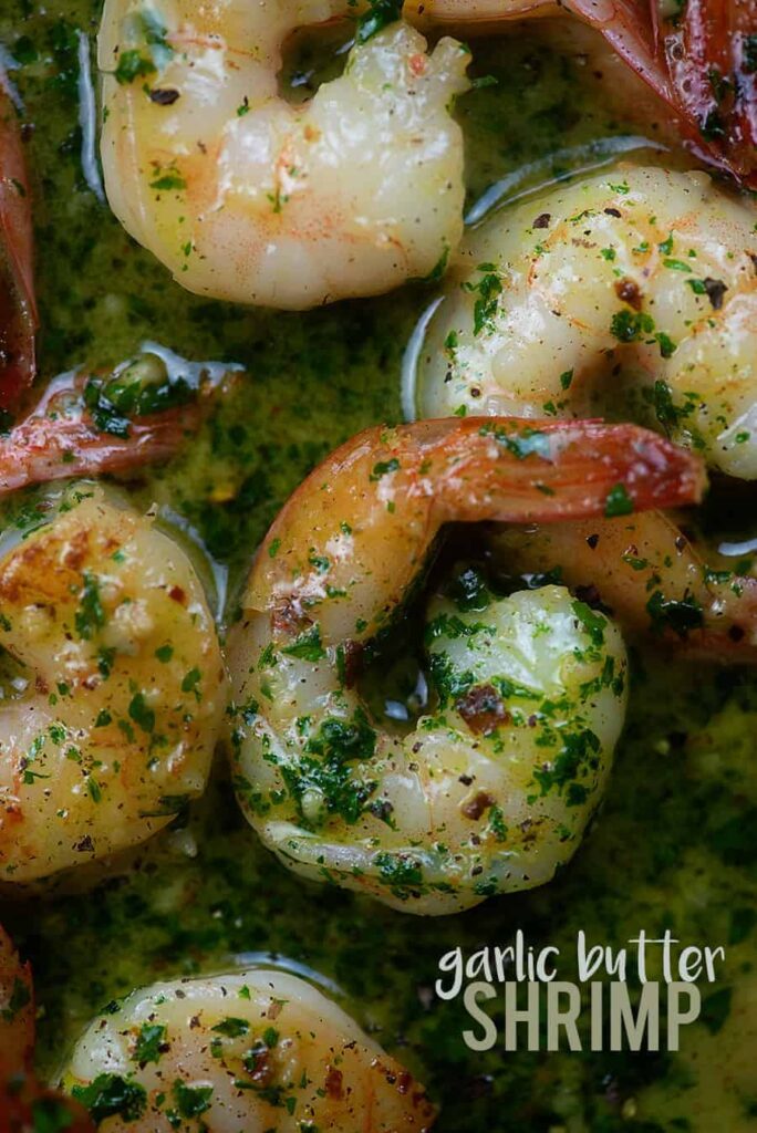 close-up shot of garlic butter shrimp on a skillet