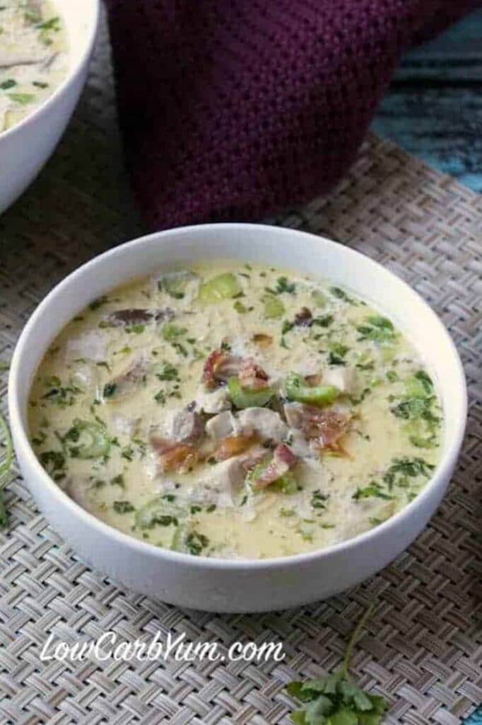 close-up angled shot of a bowl of keto cream of chicken soup with bacon