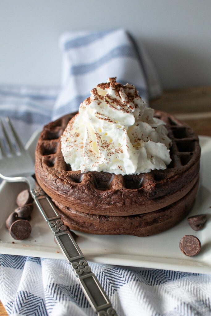 an image of chocolate brownie chaffle served on a square shaped plate