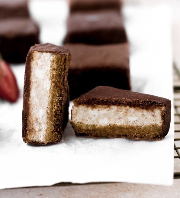 close up shot of Low-Carb Chocolate-Covered Strawberry Cheesecake Bar cut in half