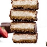 delicious low carb Chocolate Covered Strawberry Cheesecake Bars cut in half and stacked on top of each other