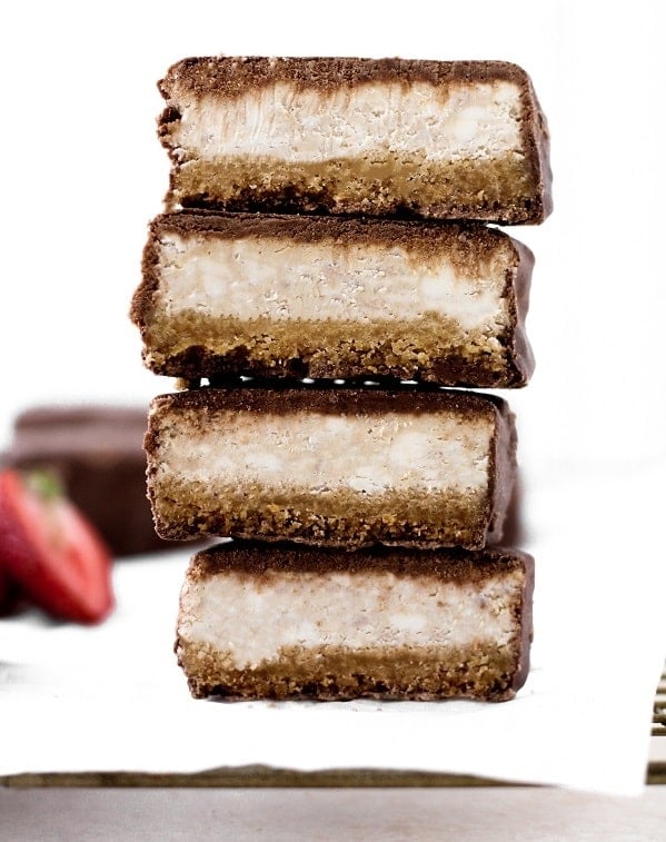 delicious low carb Chocolate Covered Strawberry Cheesecake Bars cut in half and stacked on top of each other