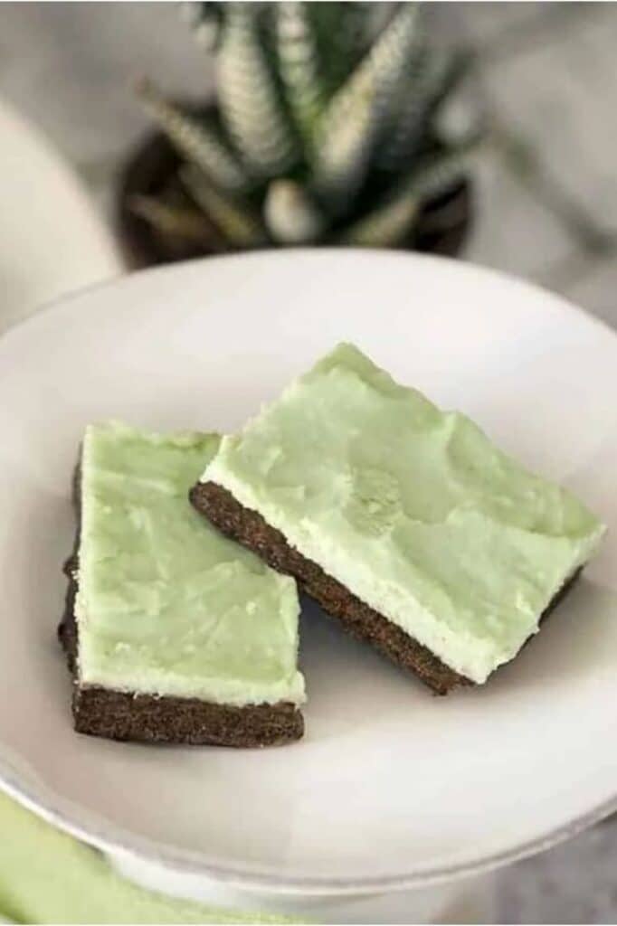 close-up image of Two Keto Mint Brownies on a plate for St. Patrick's Day Keto Recipes Roundup