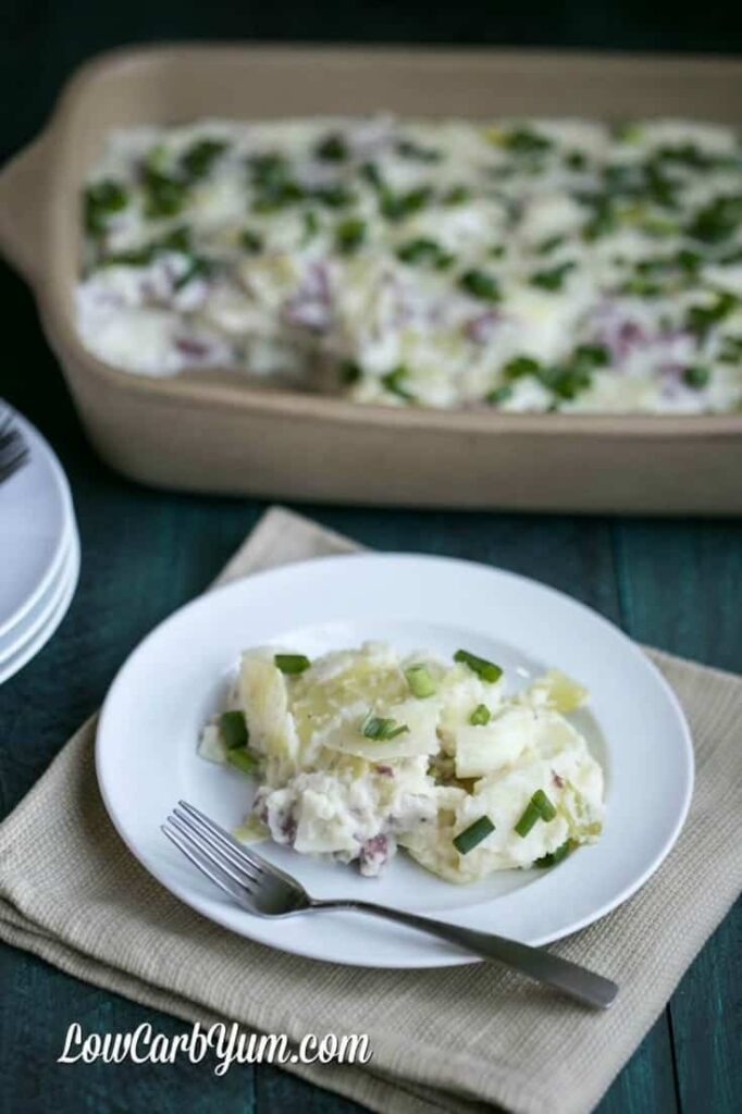 one serving of low-carb corned beef cabbage colcannon on a plate with a fork on the side