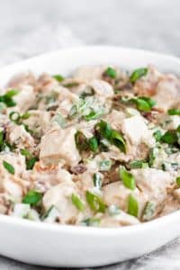 jalapeno-popper-chicken-salad in a bowl garnished with minced chives