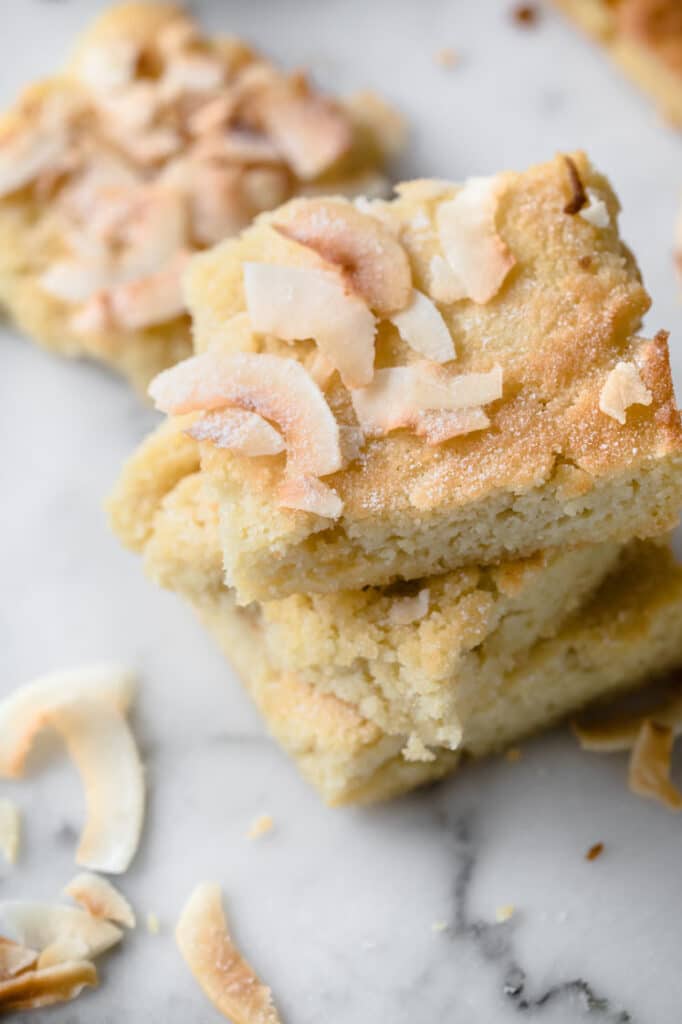 low carb coconut blondies stacked close up