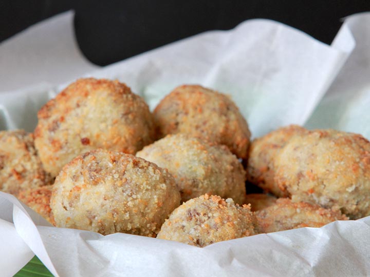 close-up image of a basket full of sauerkraut sausage balls