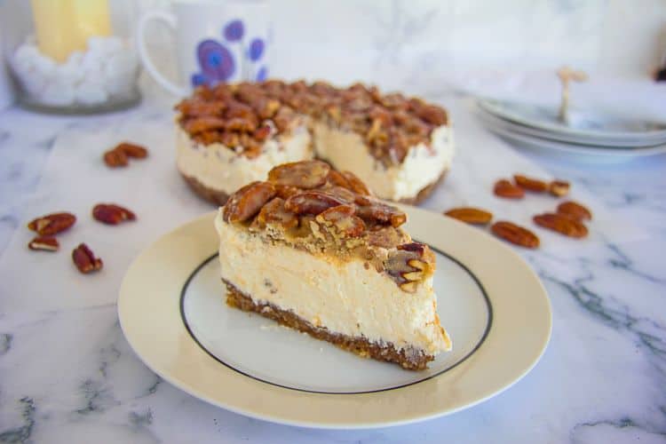 one serving of no-bake keto pecan cheesecake on plate atop a table