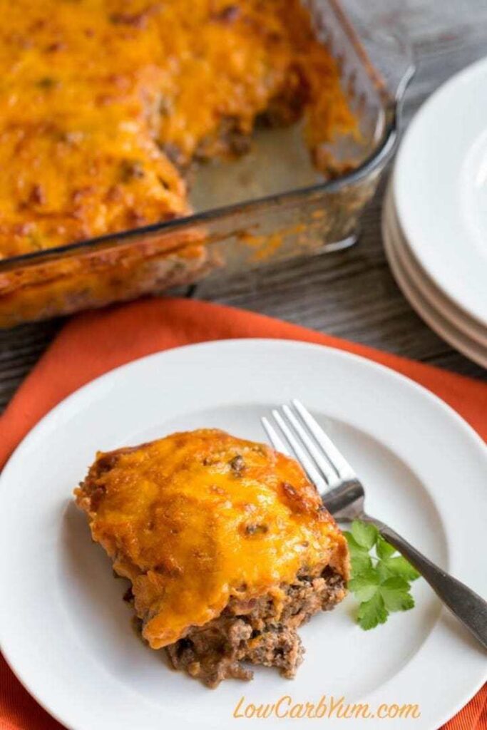 a close-up shot of low carb bacon cheeseburger casserole served on a porcelain plate