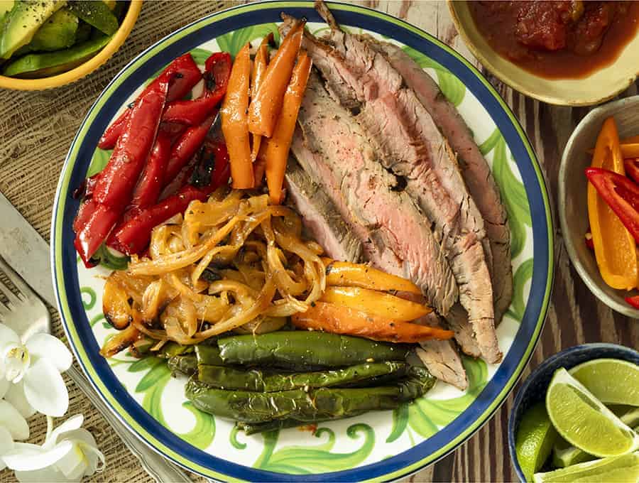 keto steak recipes - overhead shot of a plate of flank steak fajitas