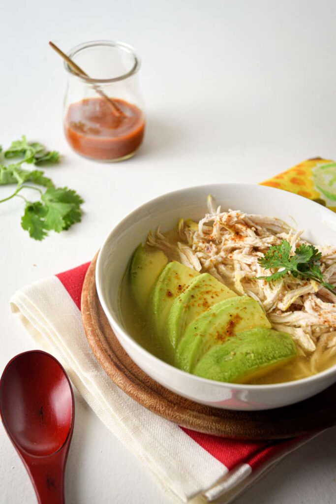 Keto Mexican-Inspired Recipes - a bowl of Avocado Chicken Posole