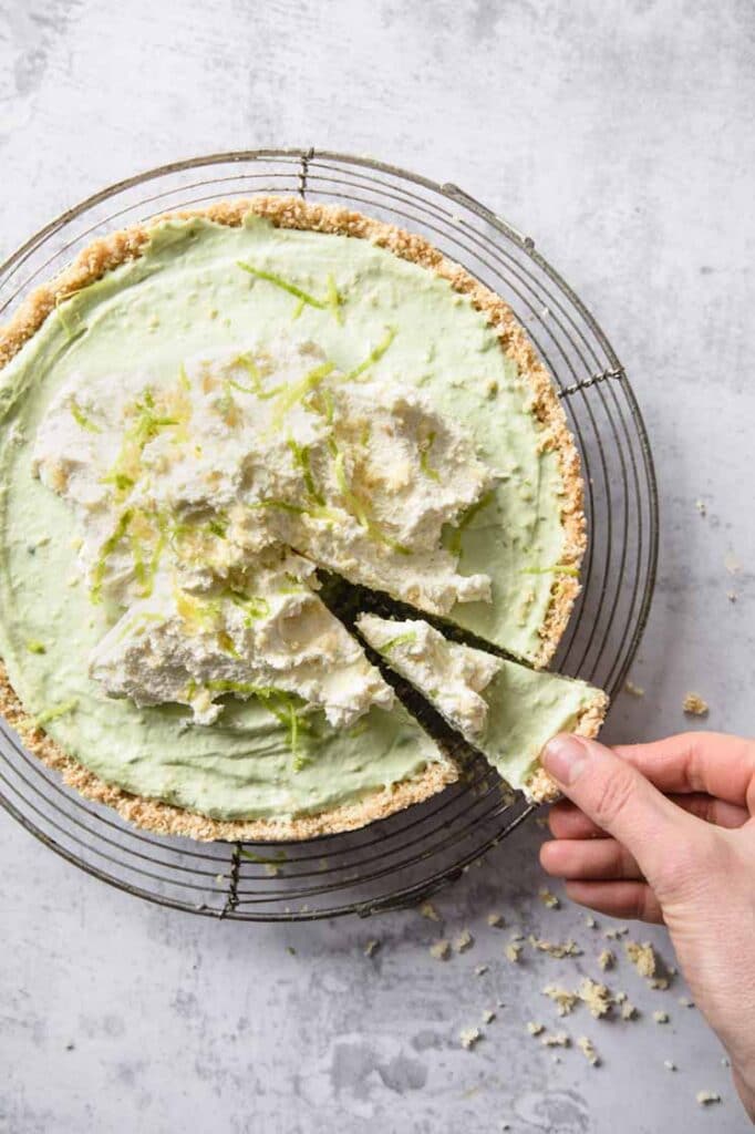 overhead image of a whole Keto Key Lime Pie atop a marble kitchen counter