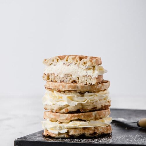 3 keto cream puff chaffles stacked on top of each other - recipe featured image