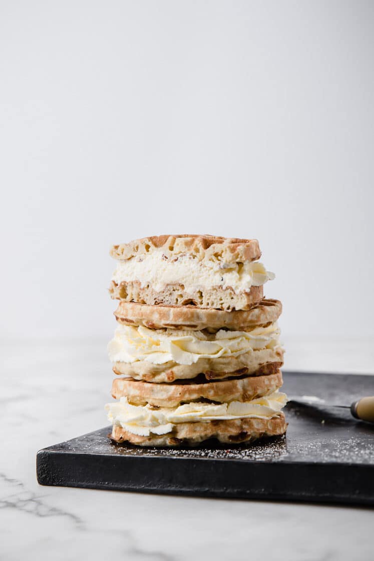 3 keto cream puff chaffles stacked on top of each other - recipe featured image