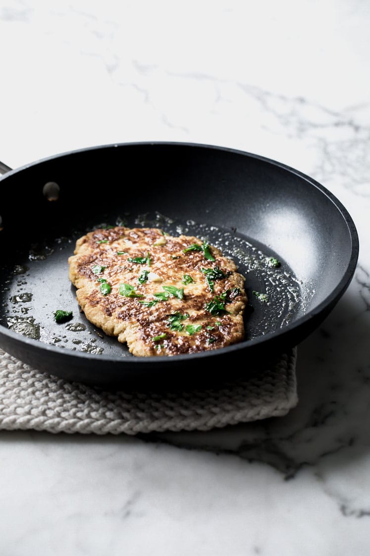nut free keto naan bread fried on a pan with butter