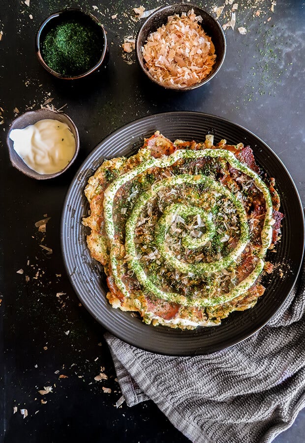 overhead shot of an okonomiyaki on a plate