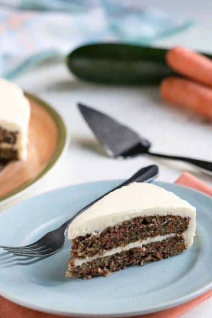 one serving of keto carrot cake on a plate atop a wooden table