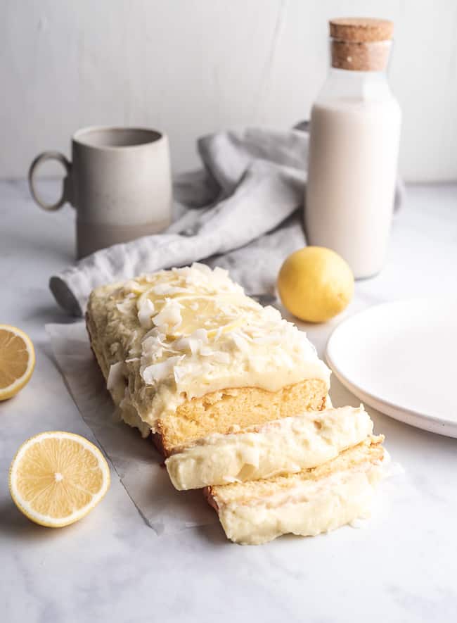 slices of lemon coconut cakr atop a marble counter