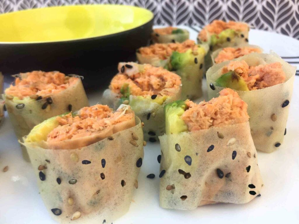 spicy salmon sushi roll on a plate