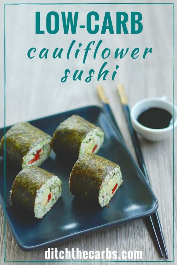 4 cauliflower sushi roll on a plate with a pair of chopsticks at the side