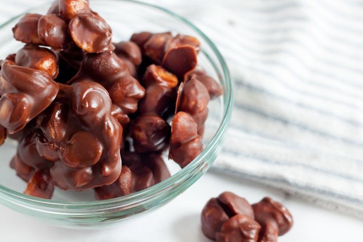 3-Ingredient Keto Recipes - chocolate macadamia nut bites in a bowl atop a marble kitchen counter