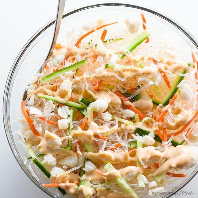 Kani Salad in a bowl atop a marble kitchen counter