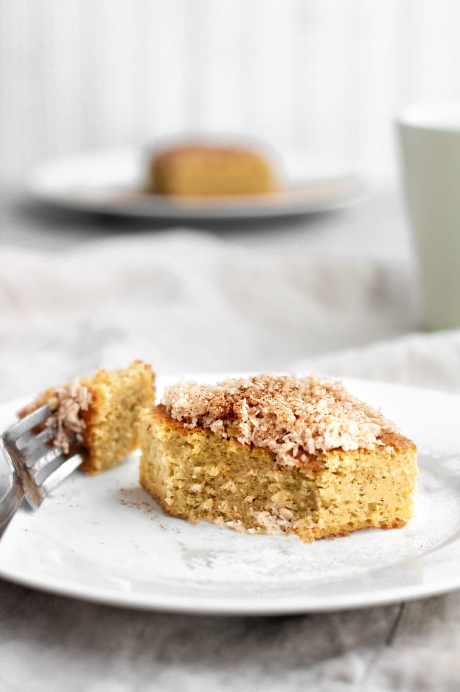 keto coffee cake sliced with a fork on a small plate