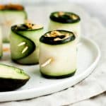 10-minute-spicy-tuna-rolls on a ceramic plate atop a cloth table napkin