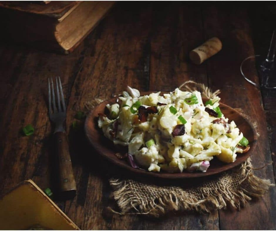 keto father's day recipes a plate full of Low-Carb Bacon Cauliflower Salad atop a wooden table