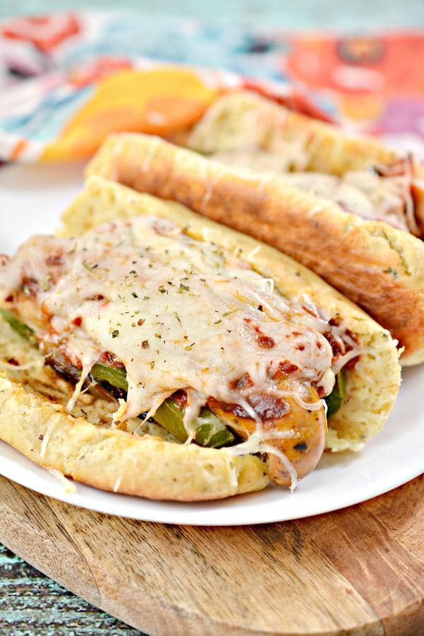 keto father's day recipes 2 italian sausage pizza hoagie on a plate atop a wooden table