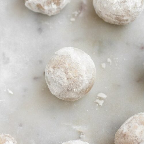 low carb powdered donut holes atop a marble kitchen counter