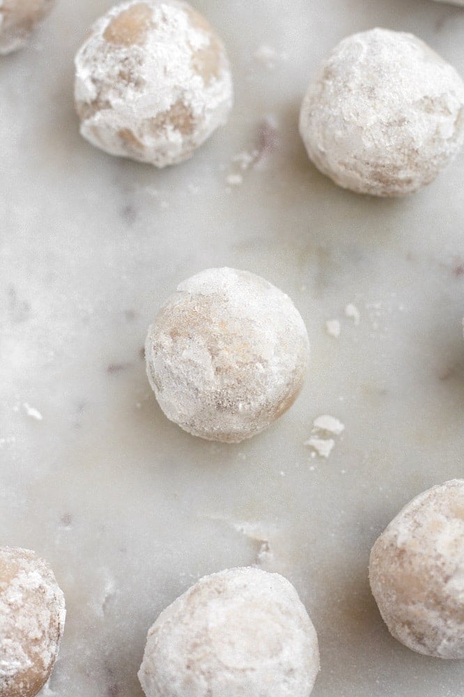 low carb powdered donut holes atop a marble kitchen counter