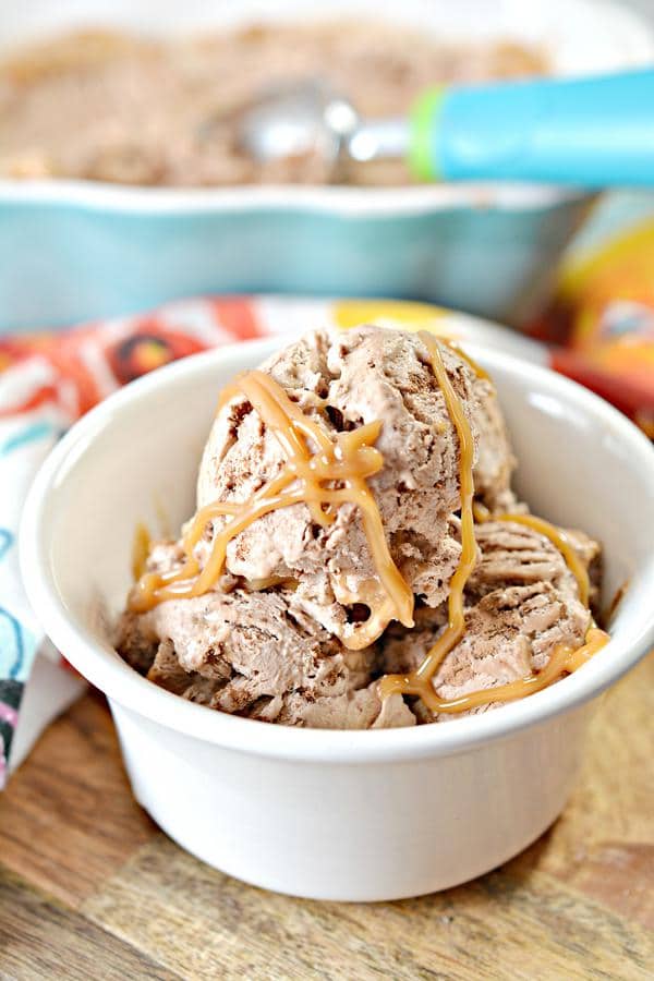 close-up image of an ice cream bowl of keto chocolate caramel ice cream atop a wooden table