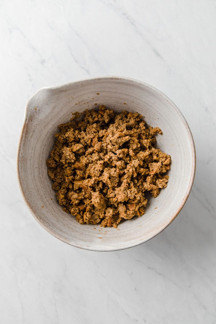 crumbled pumpkin pie cake in a mixing bowl