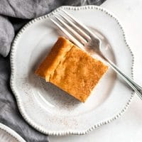 one serving of nut-free keto pumpkin cheesecake bar on a plate