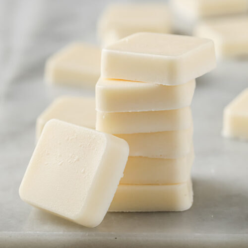 a stack of Marshmallow Fat Bombs resting atop a marble kitchen table