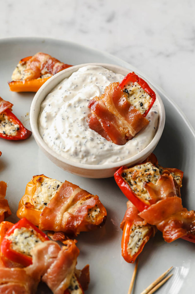 a plate of bacon-wrapped pepper poppers.