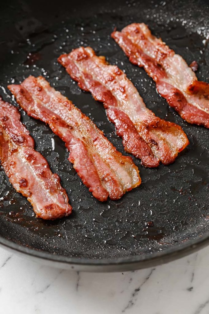 cooked crispy bacon in skillet