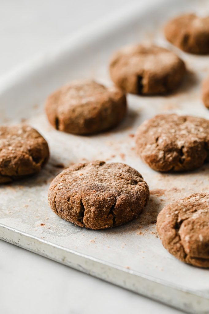 baked low-carb snickerdoodle cookies on top of baking sheet lined with parchment paper