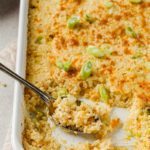 side angle shot of sour cream and onion cauliflower bake with spoon