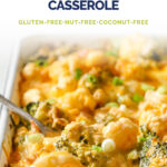 Low-Carb Loaded Broccoli Cauliflower Casserole Pin - Overhead shot of the Loaded Broccoli Cauliflower Casserole in a baking pan with a fork, atop a marble countertop.