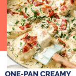 One-Pan Creamy Dijon Chicken WordPress Pin. The photo shows an overhead shot of a large pan with the One-Pan Creamy Dijon Chicken garnished with bacon crumbles, fresh parsley, and freshly-cracked pepper with a spatula scooping up a portion for serving. Below the photo, there’s text in navy blue letters that say “One-Pan Creamy Dijon Chicken” and a coral-pink text box with white letters that say “gluten-free · nut-free · coconut-free”.